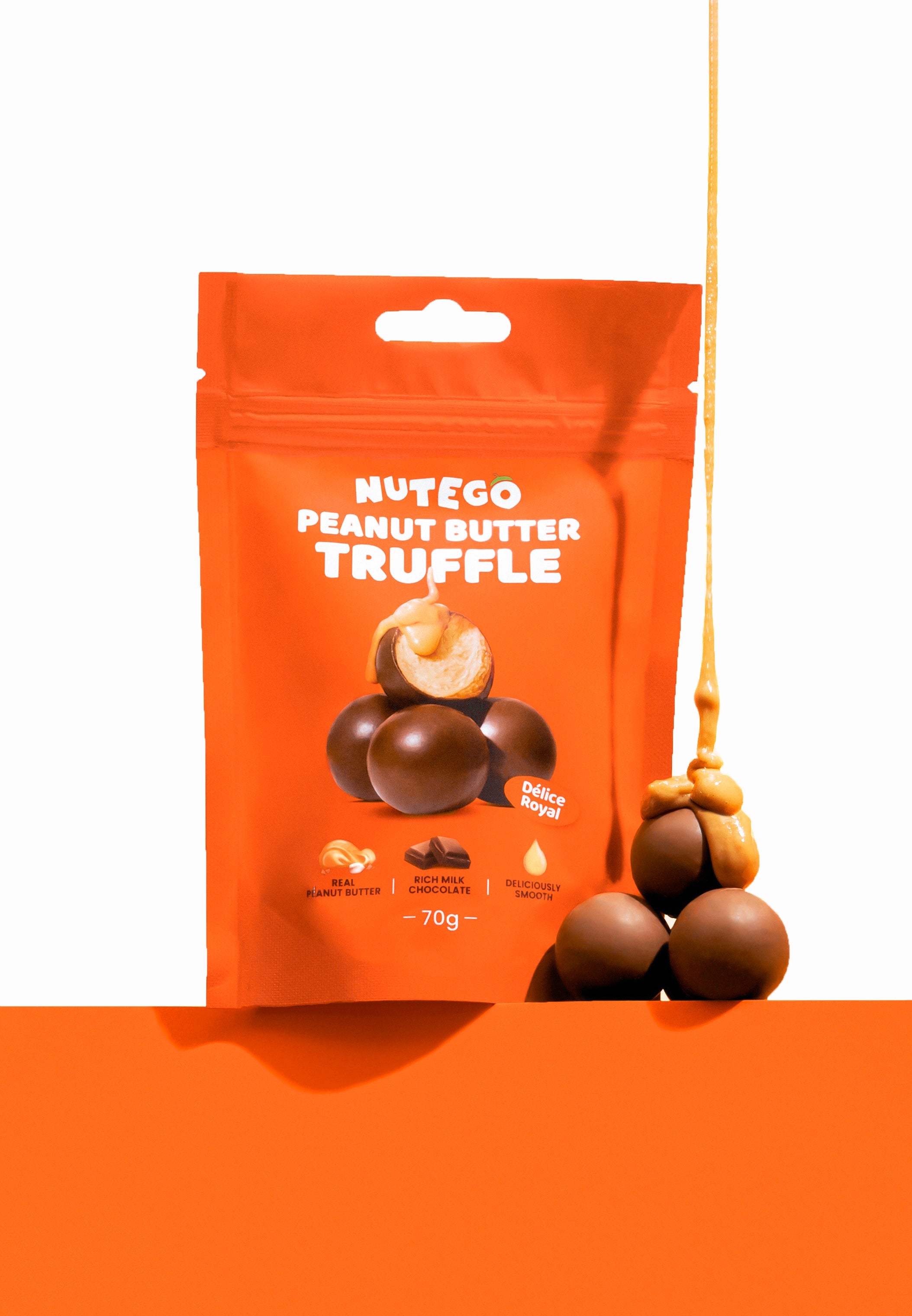 Piena šokolādes trifeles ar zemesriekstu krēma pildījumu 70g