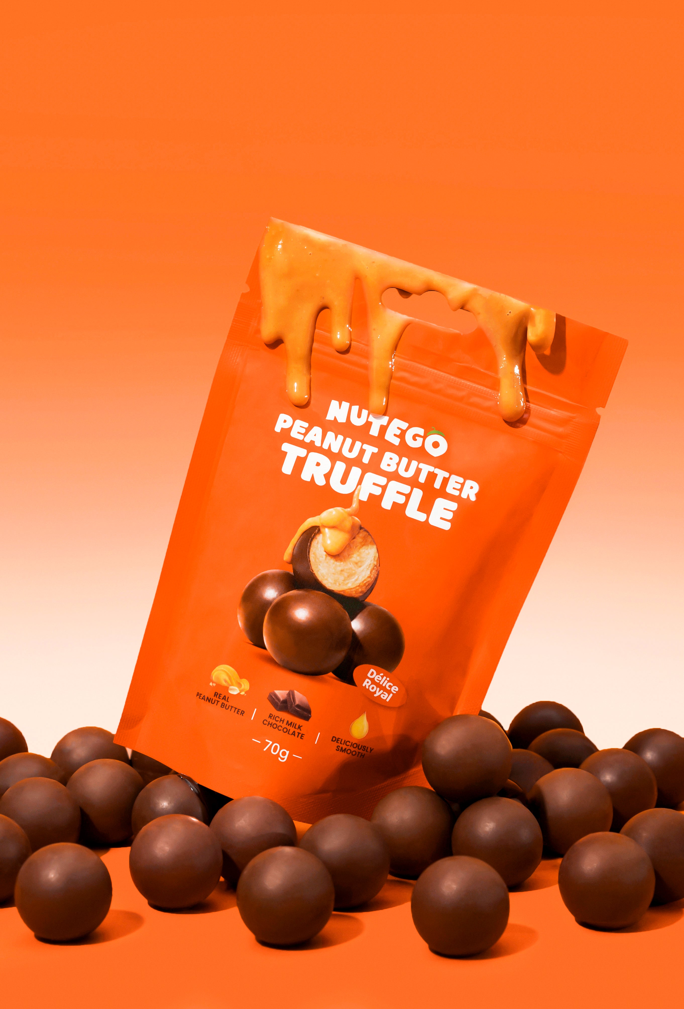 Piena šokolādes trifeles ar zemesriekstu krēma pildījumu 70g