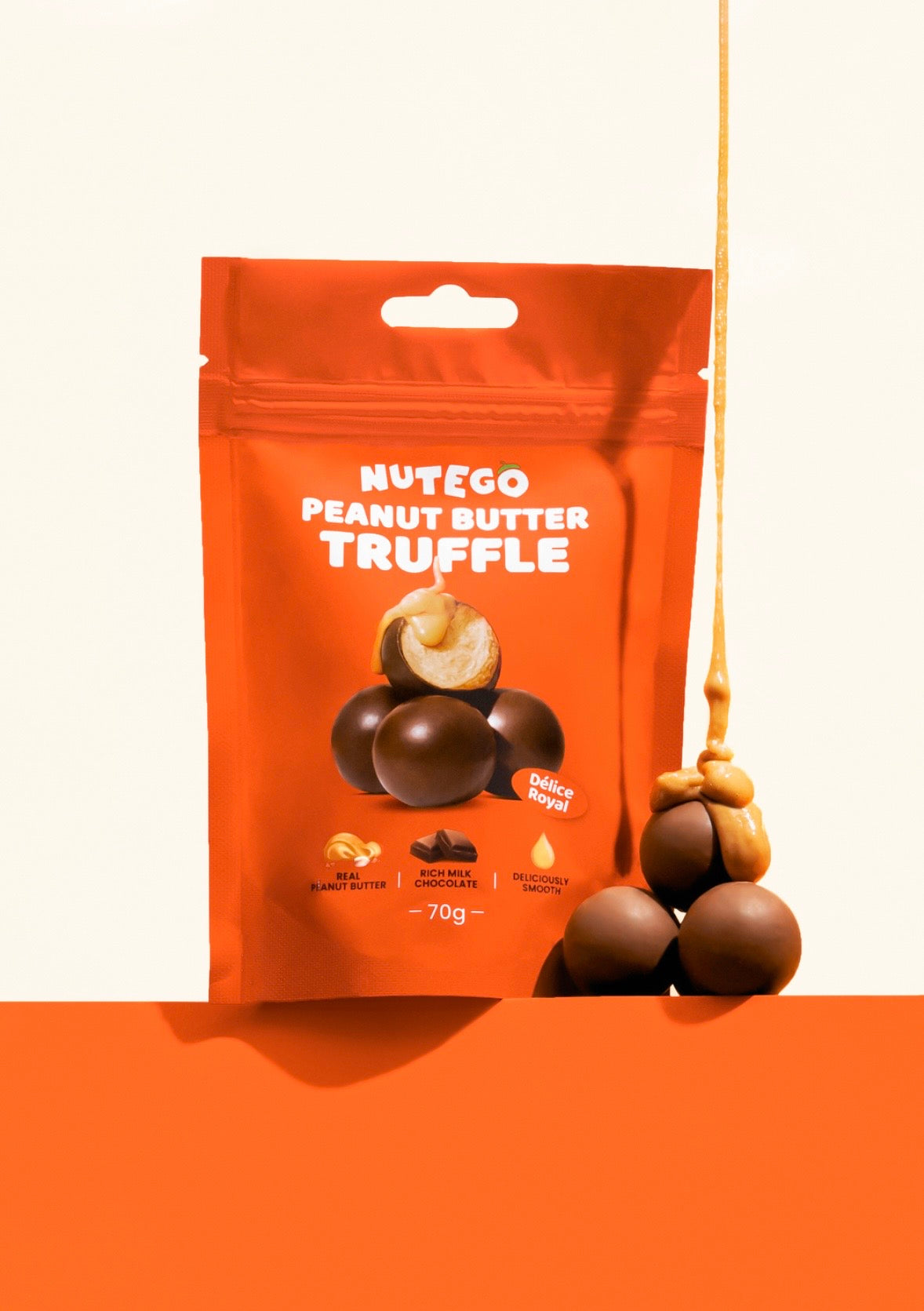 Piena šokolādes trifeles ar zemesriekstu krēma pildījumu 70g